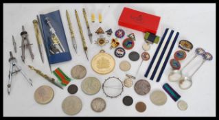 A collection of vintage items to include enamel badges, coins, medals and medal ribbons, etc. Please