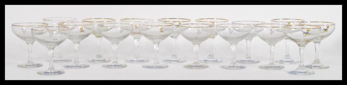 A group of vintage Babycham glasses to include seven white faun hexagonal stem glasses and ten other