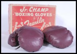 A 1940's set of children's Jr. Champ boxing gloves by Franklin in their original box made from