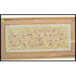 A 20th century Chinese silk hand embroidered tapestry depicting the 100 children being framed and