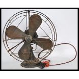 A vintage retro 1930's Art Deco GEC black metal industrial office fan having copper blades with