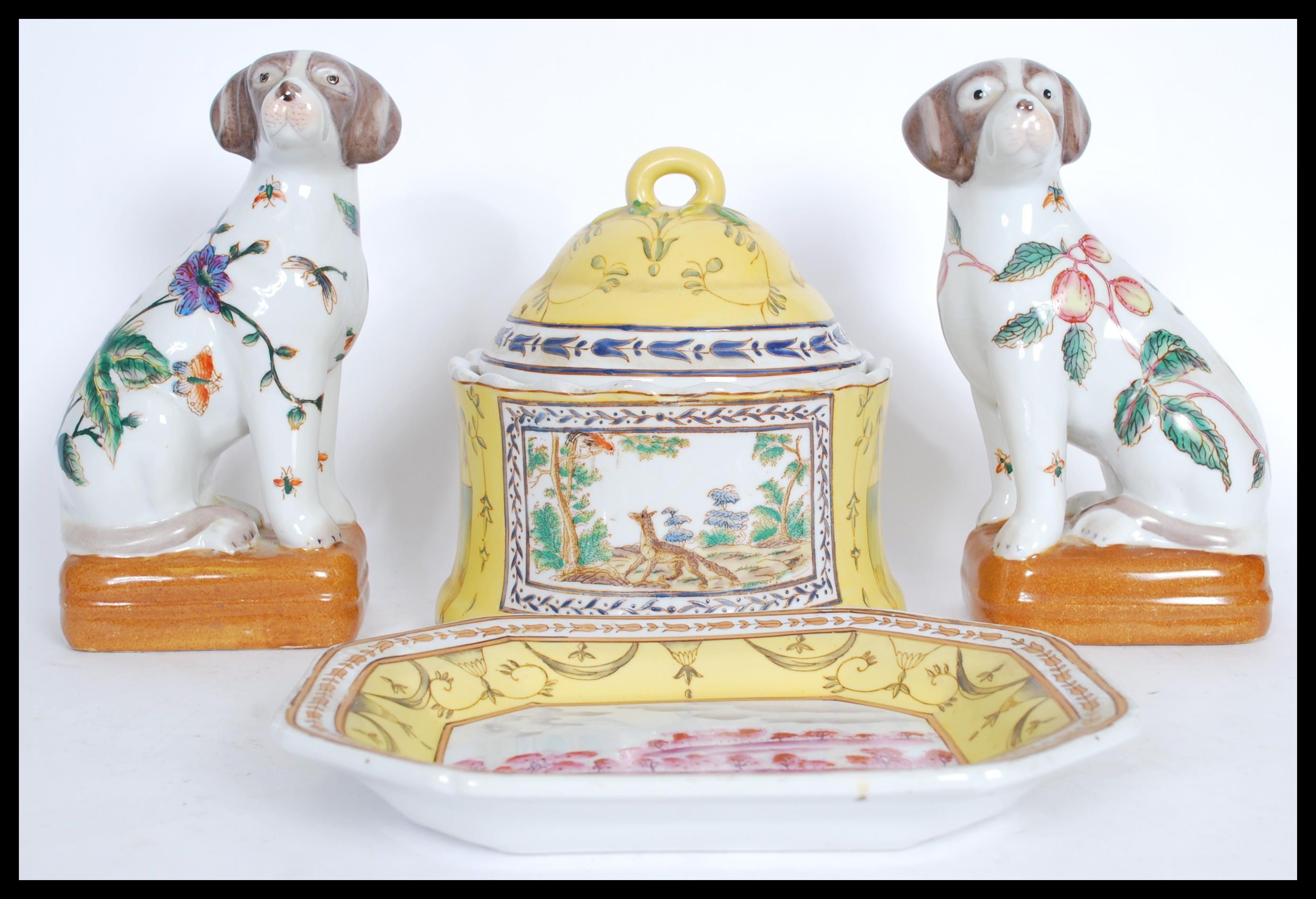 A group of 20th century Chinese ceramics to include a pair of fire side dogs decorated with peaches,