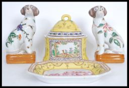 A group of 20th century Chinese ceramics to include a pair of fire side dogs decorated with peaches,