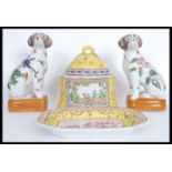 A group of 20th century Chinese ceramics to include a pair of fire side dogs decorated with peaches,