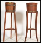 A pair of early 20th Century Edwardian coopered oak and brass bound barrel planters - plant stand