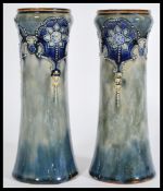 A pair of 19th century Art Nouveau tapering vases with a green and cobalt blue glaze with a floral