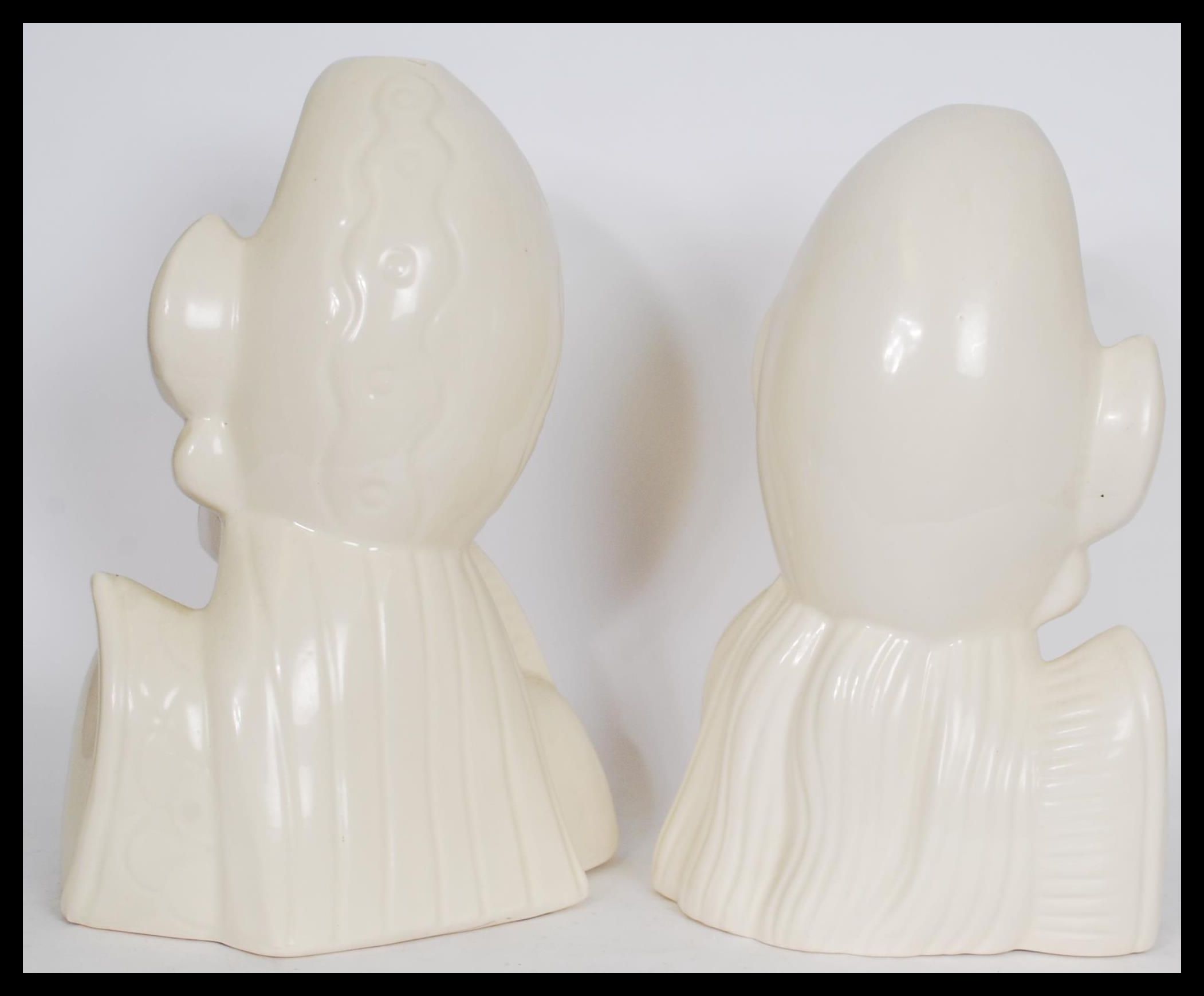 A pair of Asiatic white ceramic bust figures depicting a man and a woman in traditional dress with - Image 3 of 4