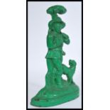 A 19th Century Victorian painted cast iron door stop, modelled as a woodsman smoking his pipe whilst