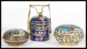 A group of three vintage 1920's cloisonne small boxes to include two brass enameled boxes of