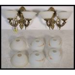 A pair of stunning gilt brass twin branch wall sconces, with  two sets of vintage milk glass