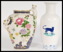 A pair of 20th century vases to include a Franklin Mint 'Vase of the imperial cats' having floral