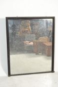 A large Victorian 19th century ebonised mahogany shop mirror. Of tall large form with an ebonised