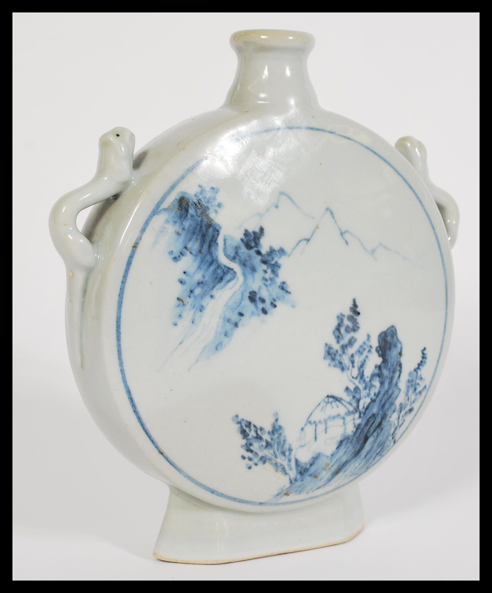 A 19th century Chinese blue and white vase of moon flask shape having hand painted details.