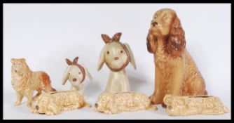 A mixed collection of vintage 20th century SylvaC ceramic figurines to include three brown dog