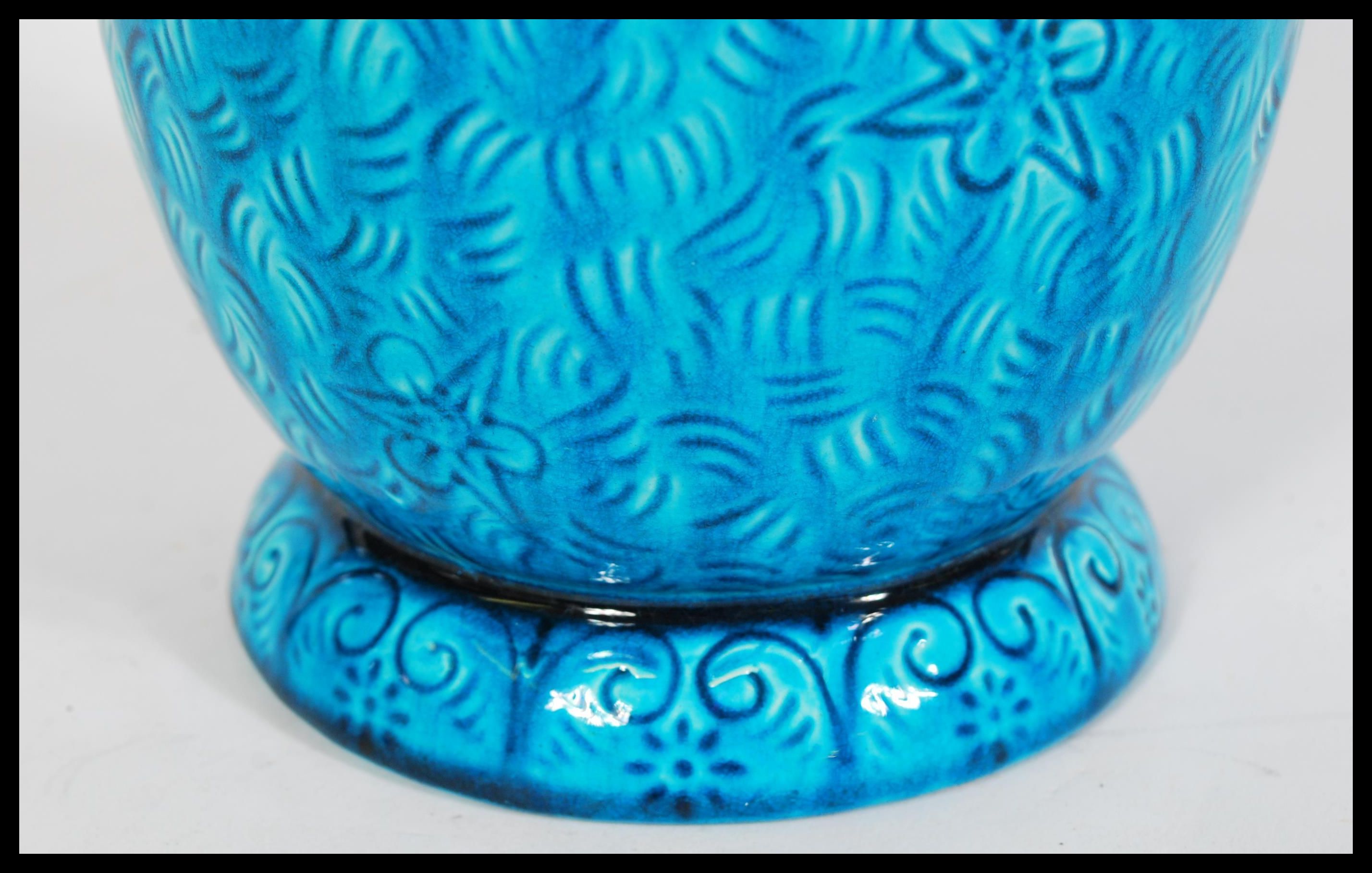 A late 19th century turquoise Burmantofts faience art pottery vase having engraved floral patterning - Image 3 of 6