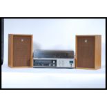 A retro 20th Century Sanyo Stereo Music System Model GXT 4520 KL, having tape p[layer / recorder,