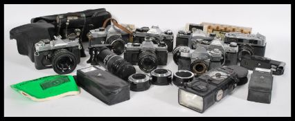 A good collection of vintage cameras and lenses to include Voigtlander folding bellows, Fujica,