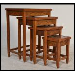 A 20th century Oriental Chinese hardwood quartetto nest of four graduating tables. each having