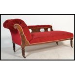 An early 20th Century Edwardian chaise lounge with upholstered button back seat, scrolled back and