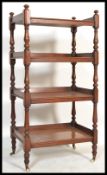 A 19th century Victorian mahogany four tier buffet ( whatnot / etargere )  supported on vase