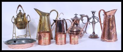 A group of vintage metal ware to include a set of graduating copper measuring pans with applied milk