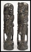 A pair of 19th century Chinese carved wooden figures with silver wire inlay depicting Daoist