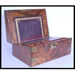 A 19th century Victorian walnut and brass bounded writing slope box having a brass escutcheon. The