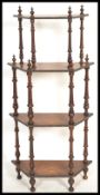 A 19th Century Victorian walnut etagere four tier  whatnot, central inlaid design to centre of all
