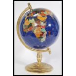 A vintage 20th century large Lapis Lazuli desk top globe raised on a stepped circular base with