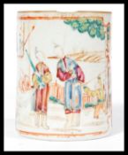 An 18th century Chinese porcelain tankard of typical form having hand painted ochre red decoration