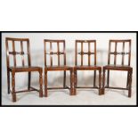 A set of four 20th Century Art Deco style dining chairs, drop in seats with a portcullis cross frame