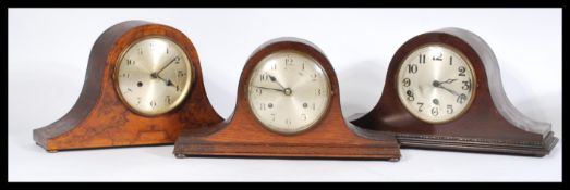 A group of three vintage 20th century Edwardian mahogany / oak cased Napoleons hat mantel clocks