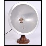 A vintage retro 20th century industrial aluminium heat lamp converted to a table lamp having a large