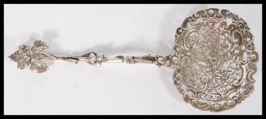 A continental silver stamped 800 large ornate sift