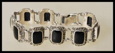 A 20th century silver bracelet with with square on