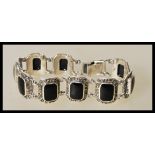 A 20th century silver bracelet with with square on