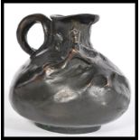 A 19th century Art Nouveau bronze ewer jug having