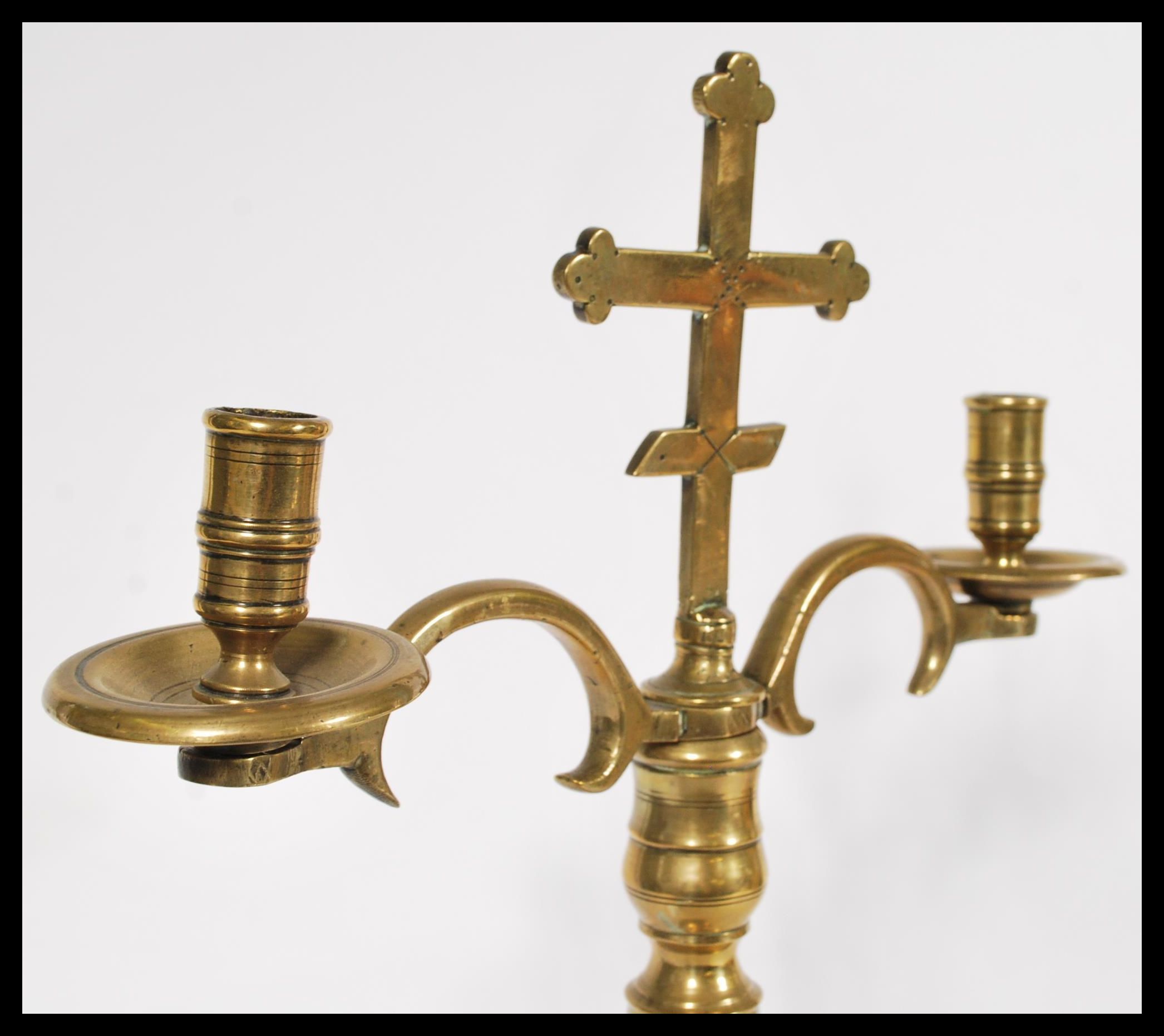 An 18th century ecclesiastical brass candelabra ra - Image 2 of 6