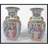 A near pair of Oriental Chinese ceramic vases one