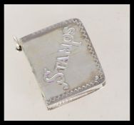A 20th century silver stamp case in the form of a