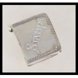 A 20th century silver stamp case in the form of a