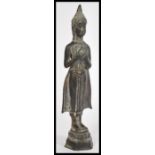 A 19th century Oriental bronze figurine of a deity