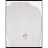 A 20th century 14ct white gold heart shaped diamon