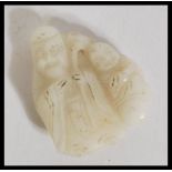 A 19th century Chinese carved white jade figurine