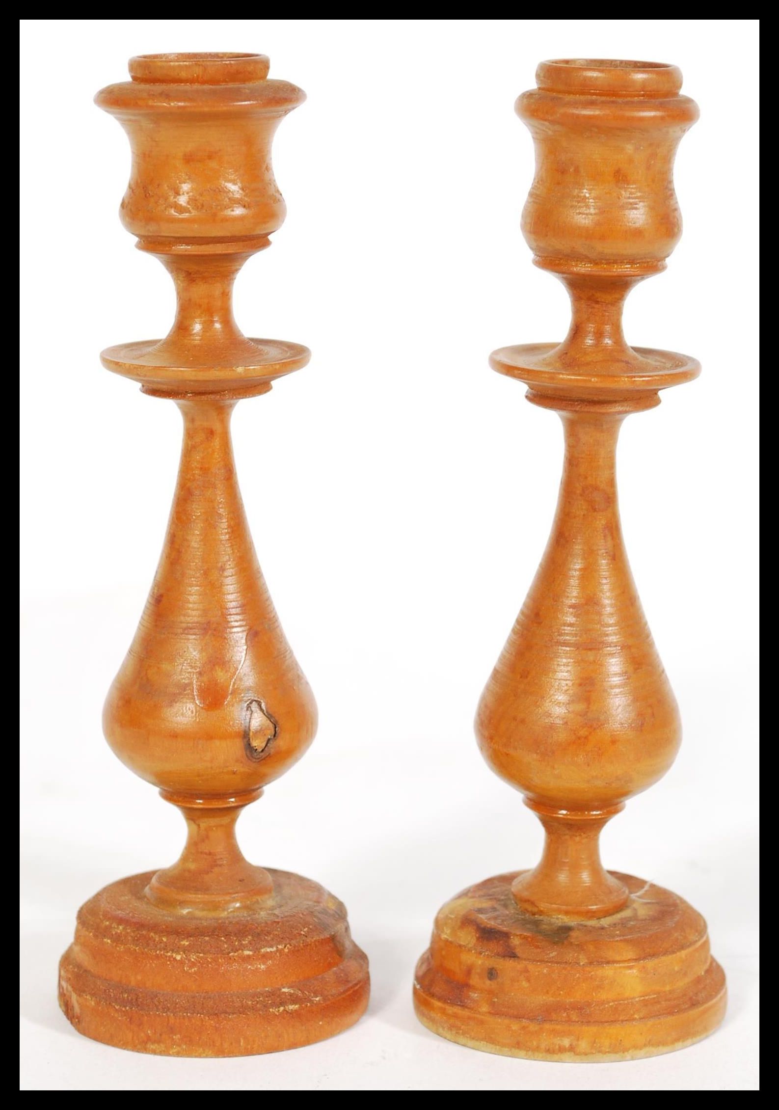 A 19th century pair of treen wooden candlesticks h