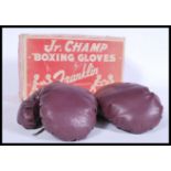 A 1940's set of children's Jr. Champ boxing gloves