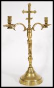 An 18th century ecclesiastical brass candelabra ra