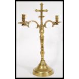 An 18th century ecclesiastical brass candelabra ra