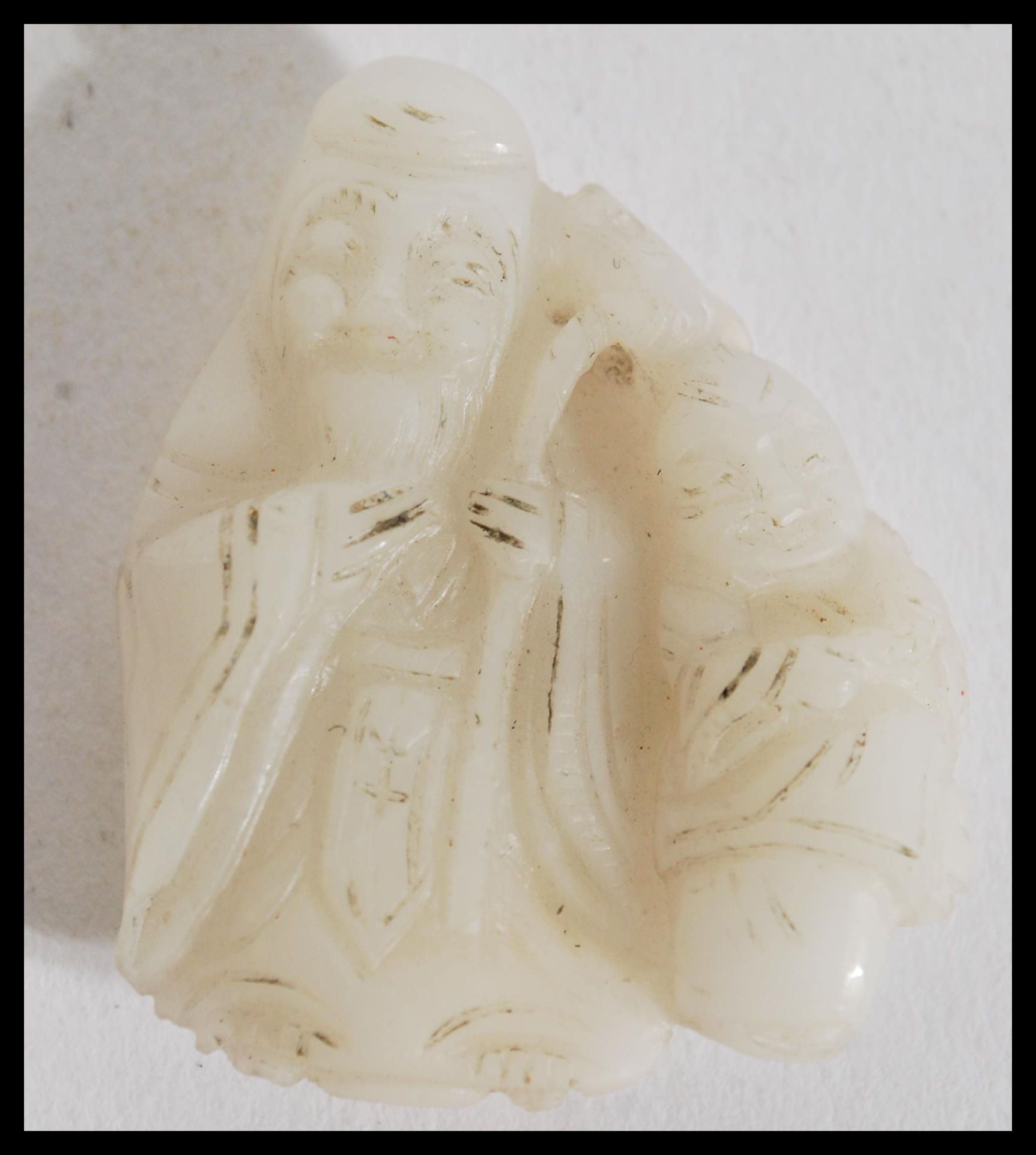 A 19th century Chinese carved white jade figurine - Image 4 of 4