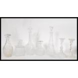 A collection of cut glass crystal decanters and ca